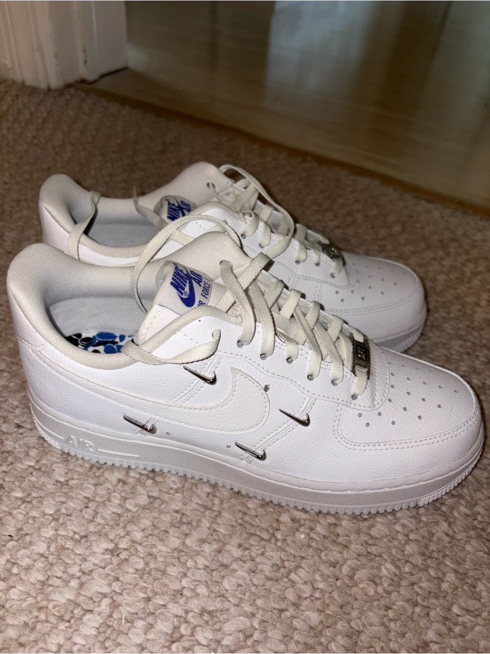 Nike White Air Force 1 Low-Top Leather Sneakers with Blue Tongue Logo